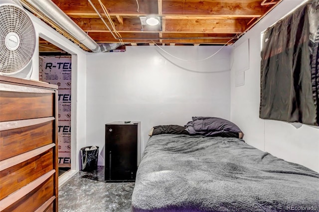 bedroom featuring concrete floors