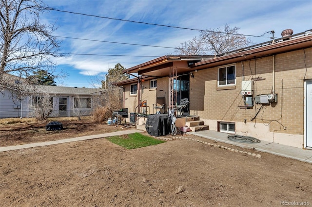 back of property with brick siding