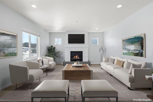 living room with dark colored carpet