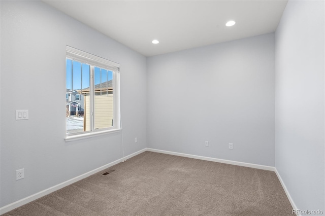 empty room featuring carpet floors