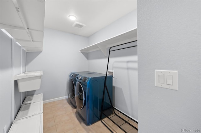 clothes washing area with independent washer and dryer