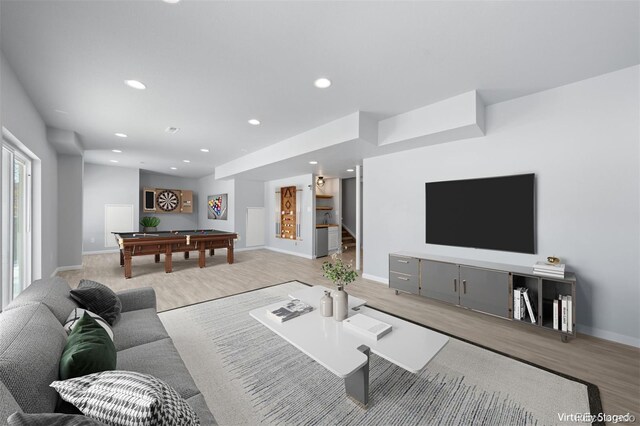 living room featuring light hardwood / wood-style floors and billiards