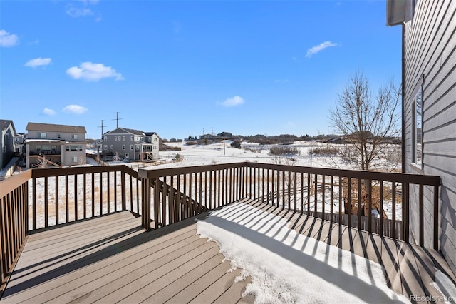 view of snow covered deck