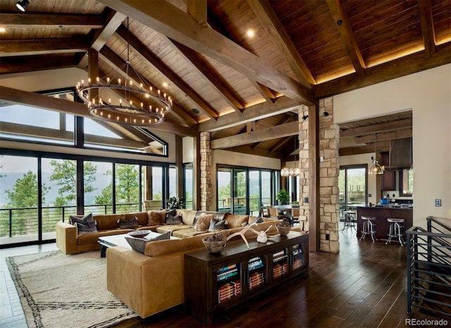 living room with dark hardwood / wood-style flooring, beamed ceiling, high vaulted ceiling, and a chandelier