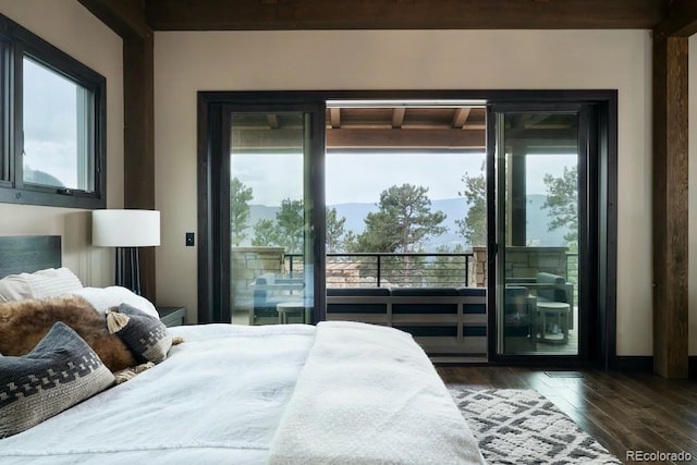 bedroom featuring dark wood-type flooring and access to outside