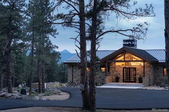 view of front of home featuring a mountain view and french doors