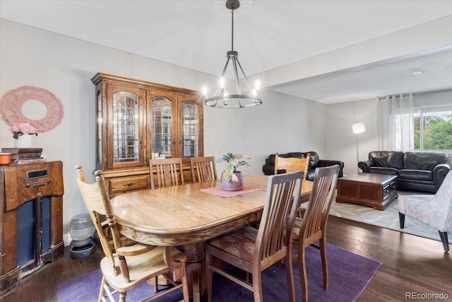 915 Mercury Cir, Littleton, CO 80124 - dining space featuring a chandelier and dark wood-type flooring