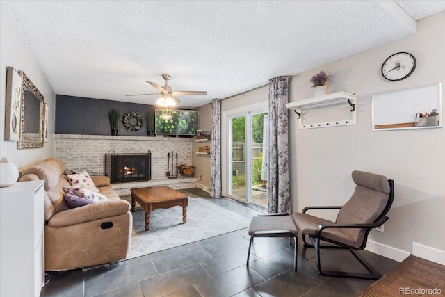 915 Mercury Cir, Littleton, CO 80124 - living room featuring ceiling fan, a textured ceiling, a fireplace, and baseboards