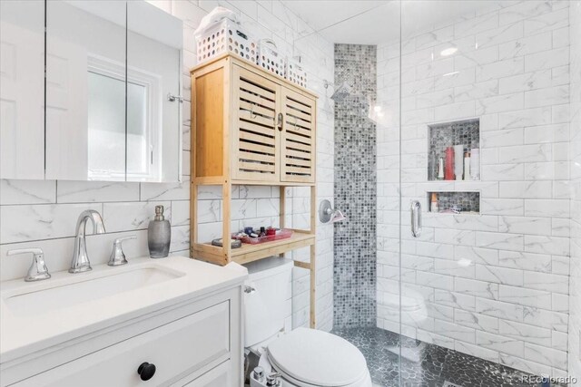 915 Mercury Cir, Littleton, CO 80124 - bathroom featuring toilet, a stall shower, vanity, tile walls, and decorative backsplash