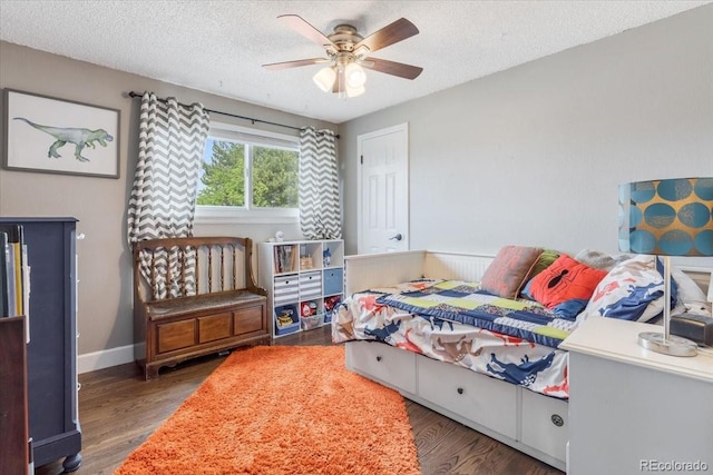 915 Mercury Cir, Littleton, CO 80124 - bedroom featuring wood finished floors, a textured ceiling, baseboards, and a ceiling fan