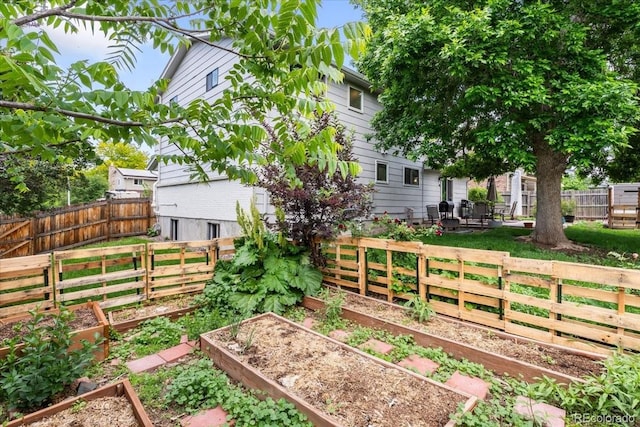 915 Mercury Cir, Littleton, CO 80124 - fenced backyard featuring a vegetable garden