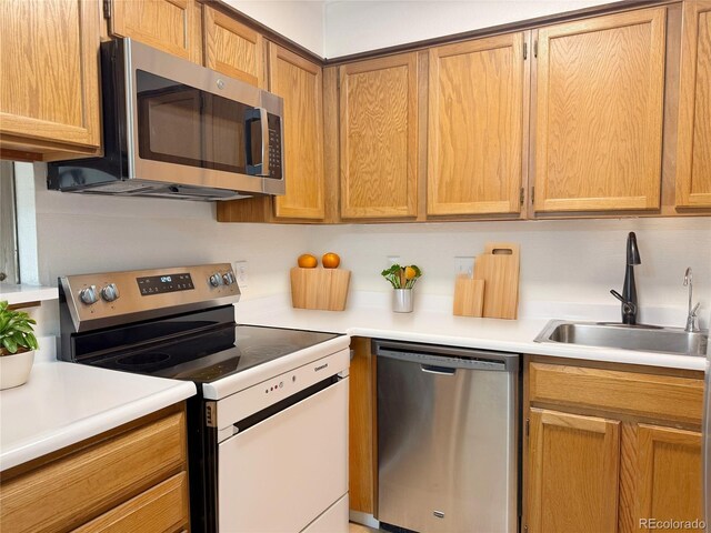 390 Zang St Unit 5-102, Lakewood, CO 80228 - kitchen featuring stainless steel appliances and sink
