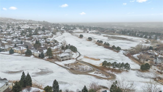 snowy aerial view featuring a residential view