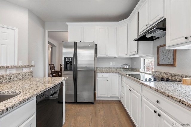 kitchen with under cabinet range hood, black appliances, wood finished floors, and white cabinetry