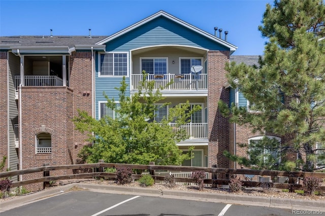 2672 S Cathay Way Unit 304, Aurora, CO 80013 - view of property with uncovered parking and fence