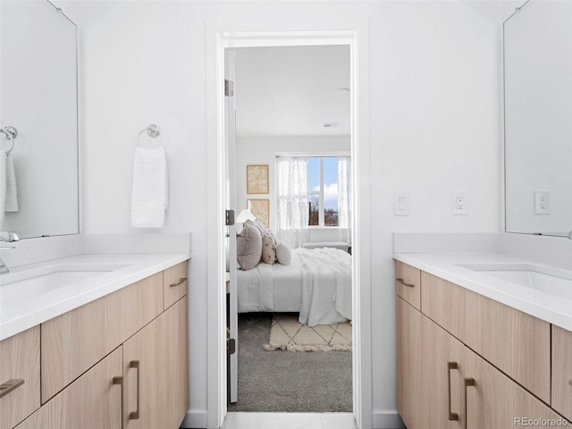 bathroom featuring tile flooring and vanity