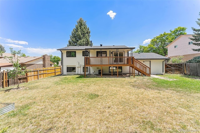 9265 Newton St, Westminster, CO 80031 - back of property with stairs, a fenced backyard, and a wooden deck