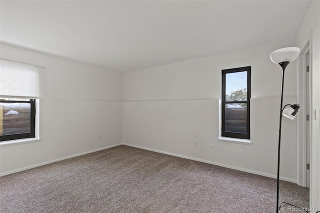 unfurnished room with carpet floors