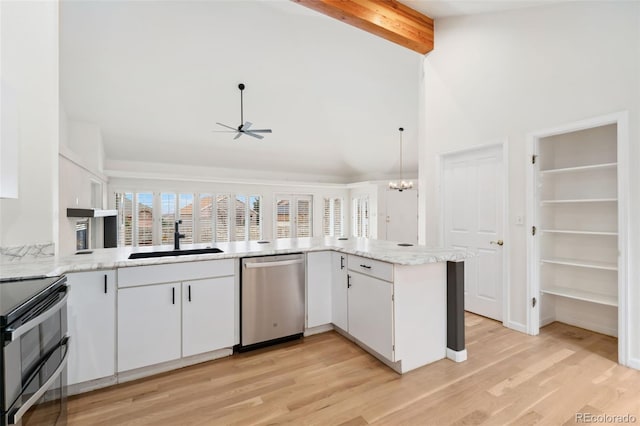 1904 S Union Pl, Lakewood, CO 80228 - kitchen featuring stainless steel dishwasher, a sink, double oven range, beamed ceiling, and white cabinets
