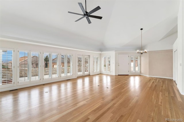1904 S Union Pl, Lakewood, CO 80228 - unfurnished living room featuring a chandelier, plenty of natural light, high vaulted ceiling, light wood-style flooring, and a ceiling fan