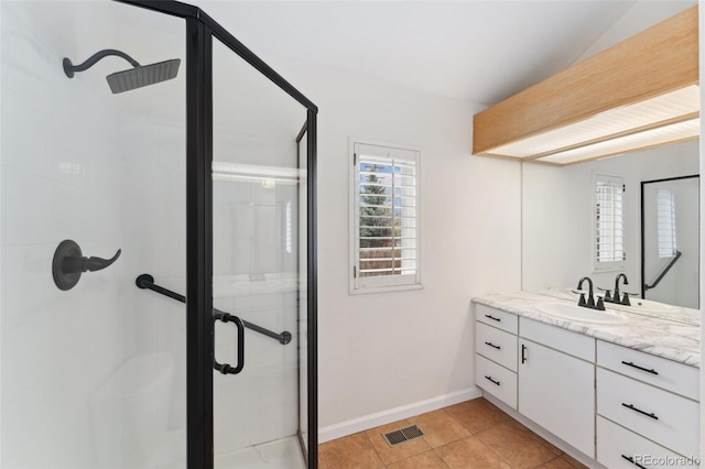 1904 S Union Pl, Lakewood, CO 80228 - bathroom with a stall shower, vanity, tile patterned floors, and baseboards