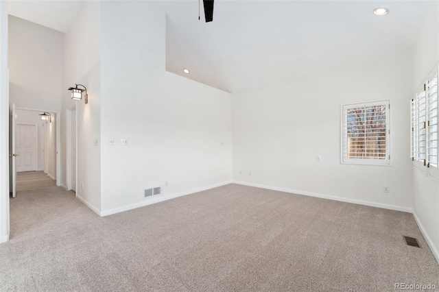 1904 S Union Pl, Lakewood, CO 80228 - carpeted spare room featuring recessed lighting, baseboards, and high vaulted ceiling
