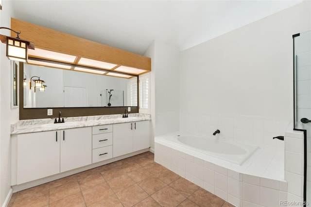 1904 S Union Pl, Lakewood, CO 80228 - full bath featuring double vanity, a garden tub, and tile patterned floors