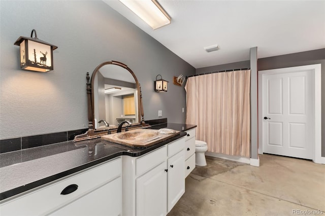 1904 S Union Pl, Lakewood, CO 80228 - bathroom featuring vanity, toilet, a shower with curtain, and concrete floors