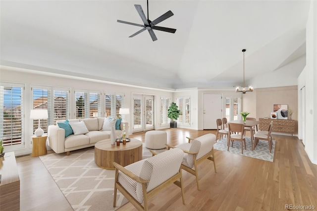 1904 S Union Pl, Lakewood, CO 80228 - living area with a chandelier, high vaulted ceiling, light wood-style floors, healthy amount of natural light, and a ceiling fan