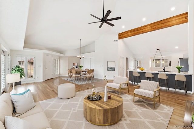 1904 S Union Pl, Lakewood, CO 80228 - living area featuring light wood-type flooring, recessed lighting, a ceiling fan, beamed ceiling, and baseboards