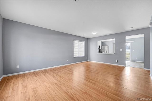 unfurnished room featuring light hardwood / wood-style floors