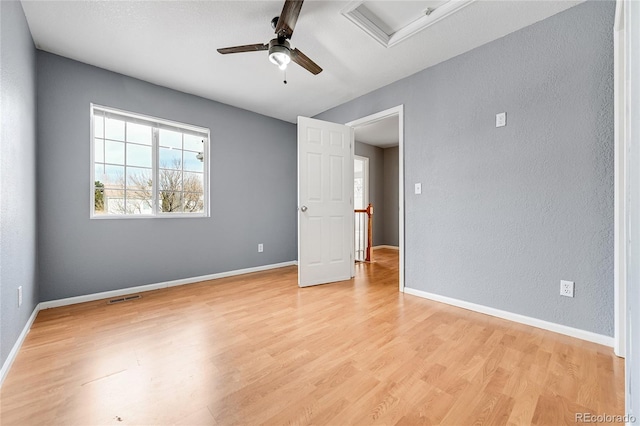 spare room featuring ceiling fan and light wood-type flooring