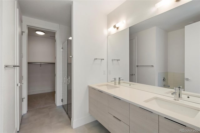 bathroom with vanity, tile patterned floors, and walk in shower