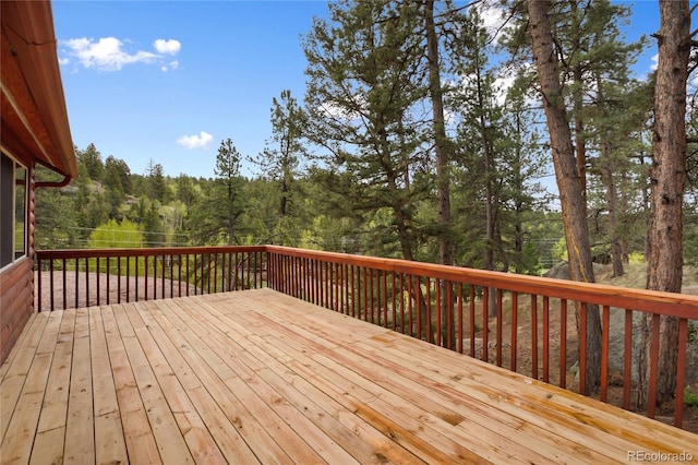481 Arrowhead, Florissant, CO 80816 - wooden terrace featuring a wooded view
