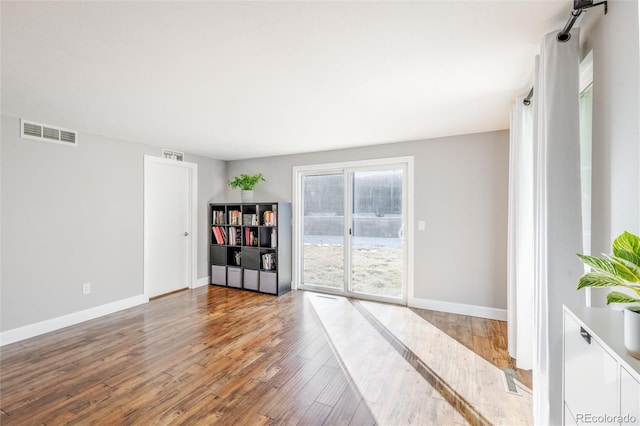 spare room featuring hardwood / wood-style flooring