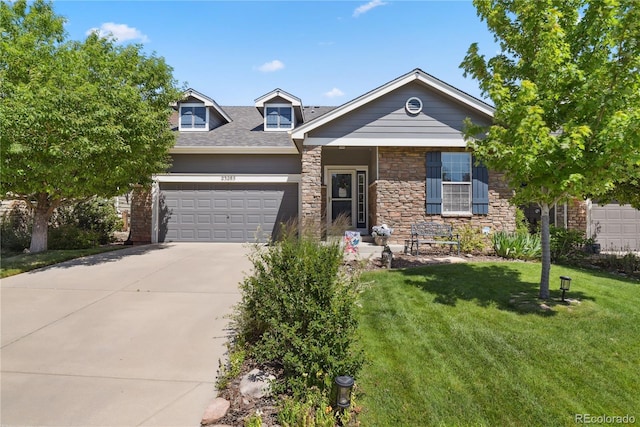 23285 Chapel Hill Ln, Parker, CO 80138 - view of front of house with a front yard, concrete driveway, an attached garage, and stone siding