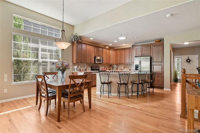23285 Chapel Hill Ln, Parker, CO 80138 - dining area featuring light wood-style floors and recessed lighting