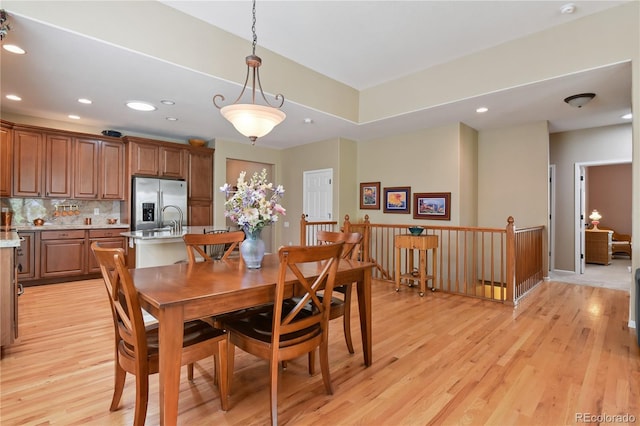 23285 Chapel Hill Ln, Parker, CO 80138 - dining room featuring light wood-style floors and recessed lighting