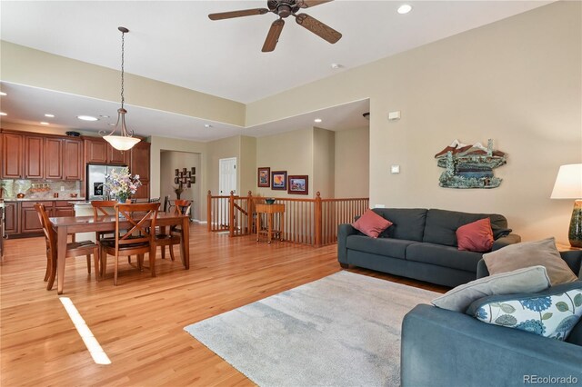 23285 Chapel Hill Ln, Parker, CO 80138 - living area featuring light wood finished floors, a ceiling fan, and recessed lighting