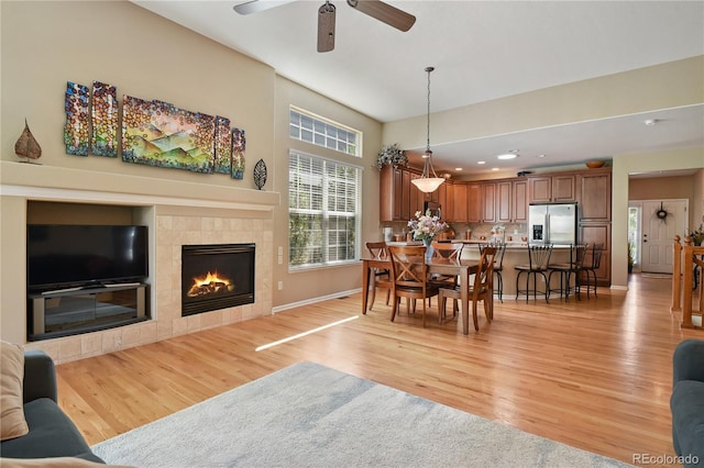 23285 Chapel Hill Ln, Parker, CO 80138 - living area featuring light wood-style flooring, a ceiling fan, a tiled fireplace, and recessed lighting