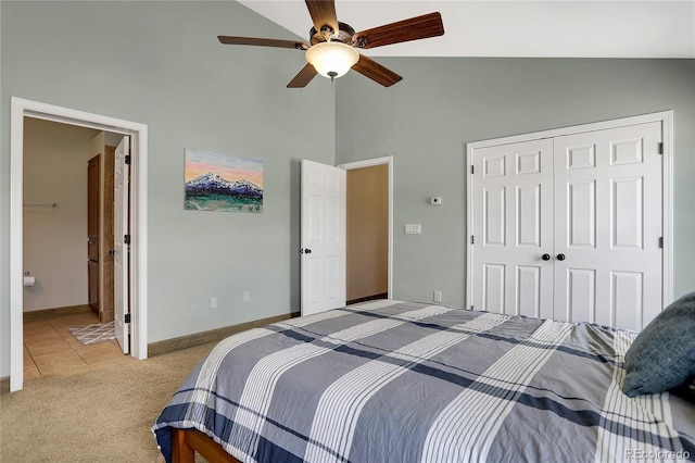 bedroom featuring a closet, baseboards, ceiling fan, high vaulted ceiling, and light colored carpet