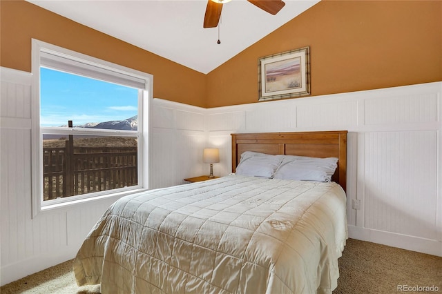 bedroom featuring a ceiling fan, lofted ceiling, and carpet