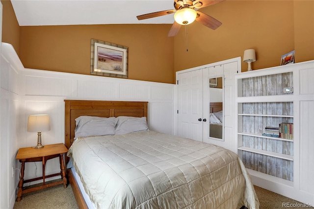 bedroom featuring ceiling fan, carpet flooring, and lofted ceiling