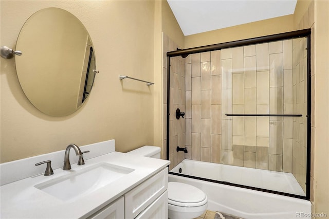 full bathroom featuring toilet, enclosed tub / shower combo, and vanity