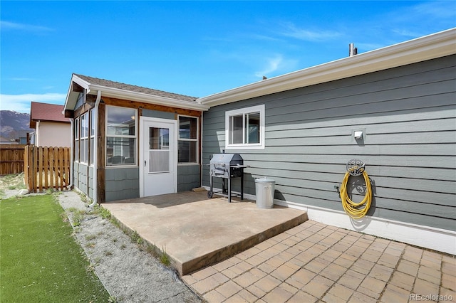 back of house featuring a patio area and fence