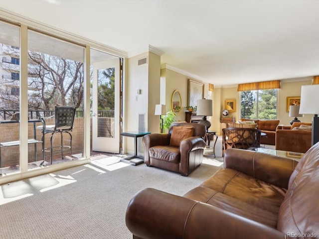 carpeted living area featuring visible vents, crown molding, and expansive windows