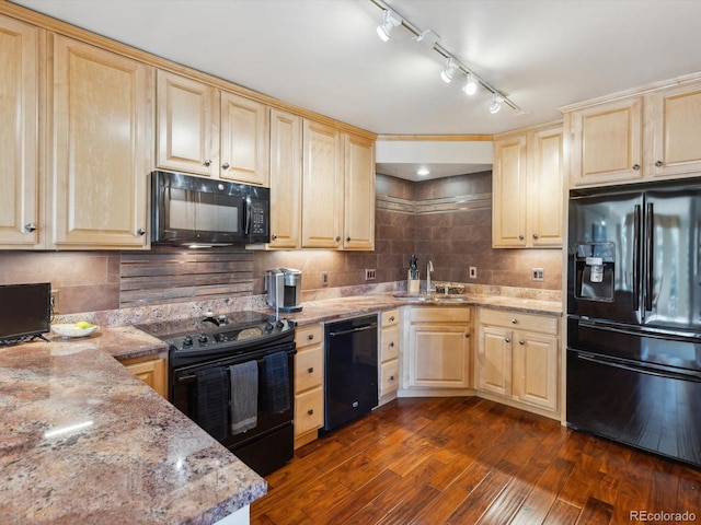 kitchen with light brown cabinets, a sink, black appliances, dark wood-type flooring, and backsplash