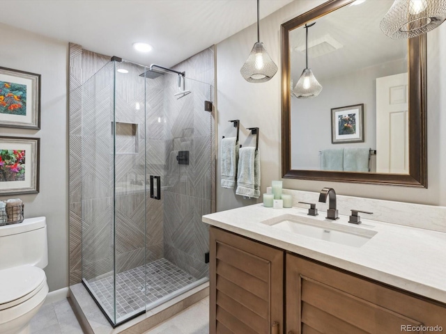 bathroom featuring toilet, recessed lighting, a shower stall, tile patterned flooring, and vanity