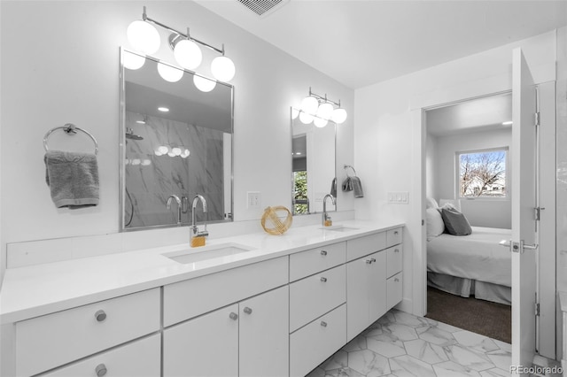 bathroom featuring vanity and a tile shower