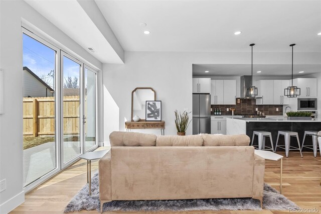 living room with light hardwood / wood-style flooring